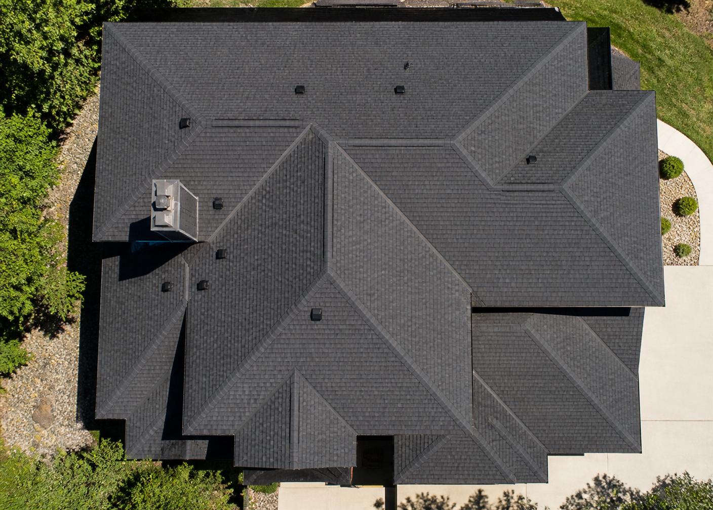 Aerial view of a precisely installed shingle roof